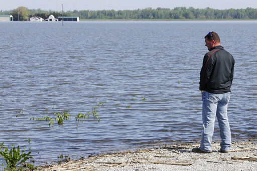 Flooded farmers face growing dilemma in warming world